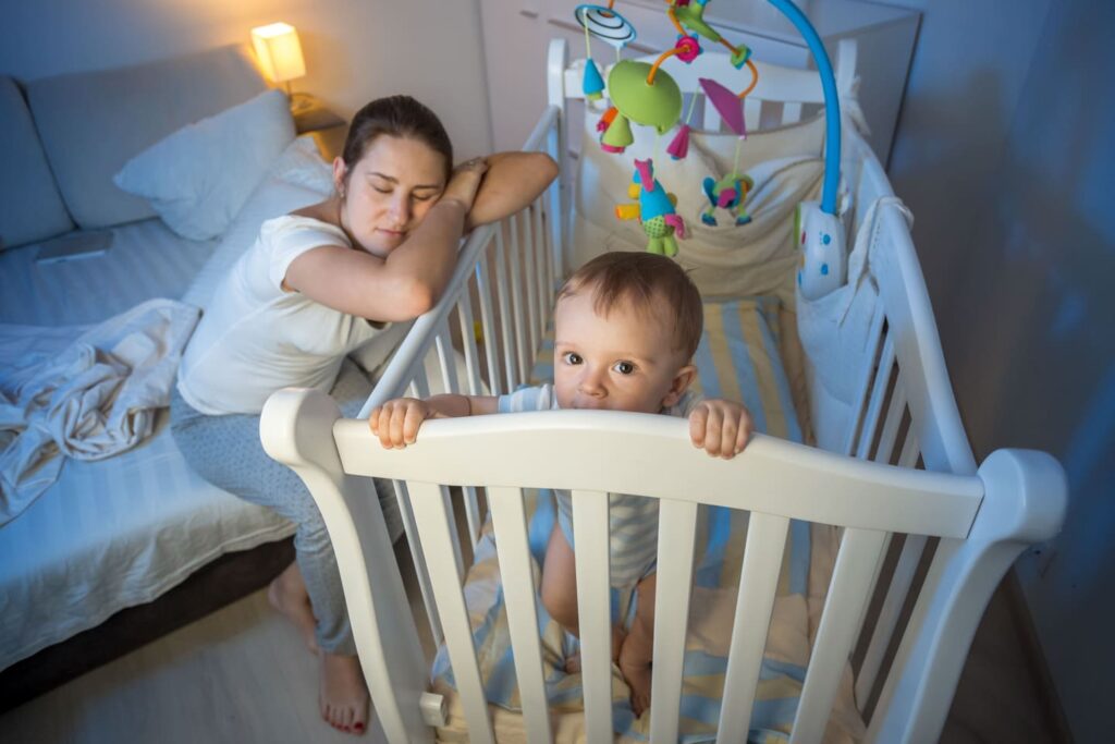 baby standing in crib