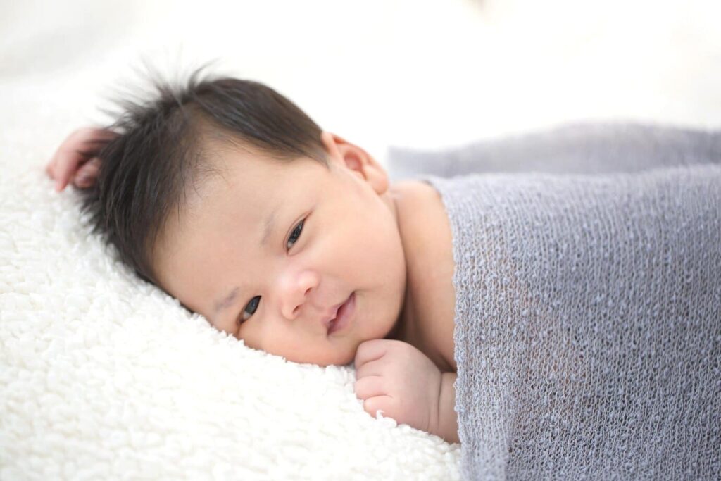 baby sleeping face down in mattress