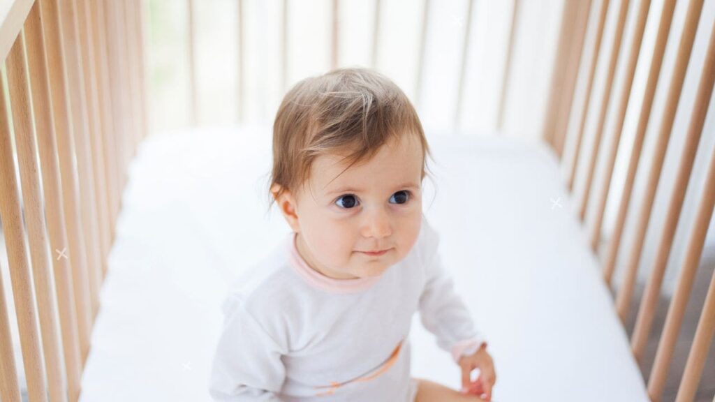 Baby Sitting Up in Crib 5