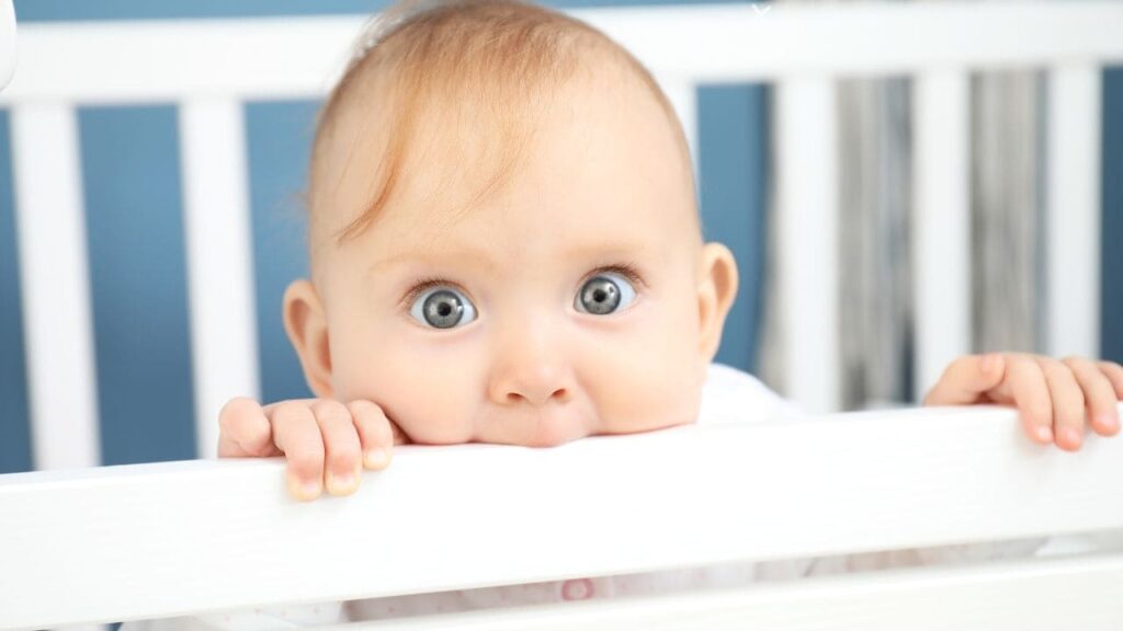 Baby Sitting Up in Crib 6