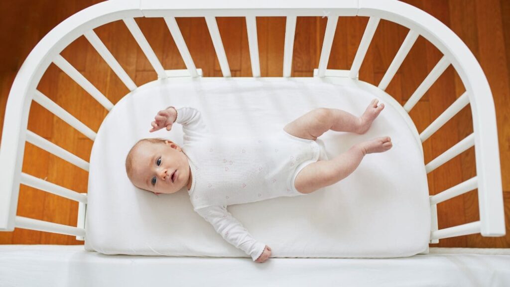 Newborn Rolling to Side in Bassinet 5